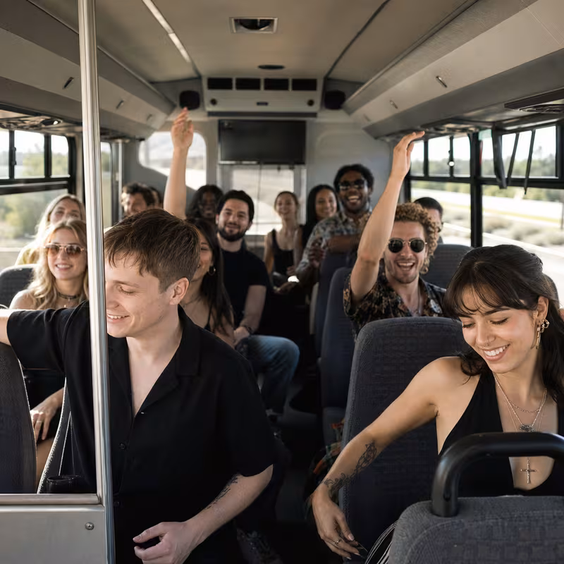 Party bus interior with wraparound leather seating and LED lighting in Raleigh