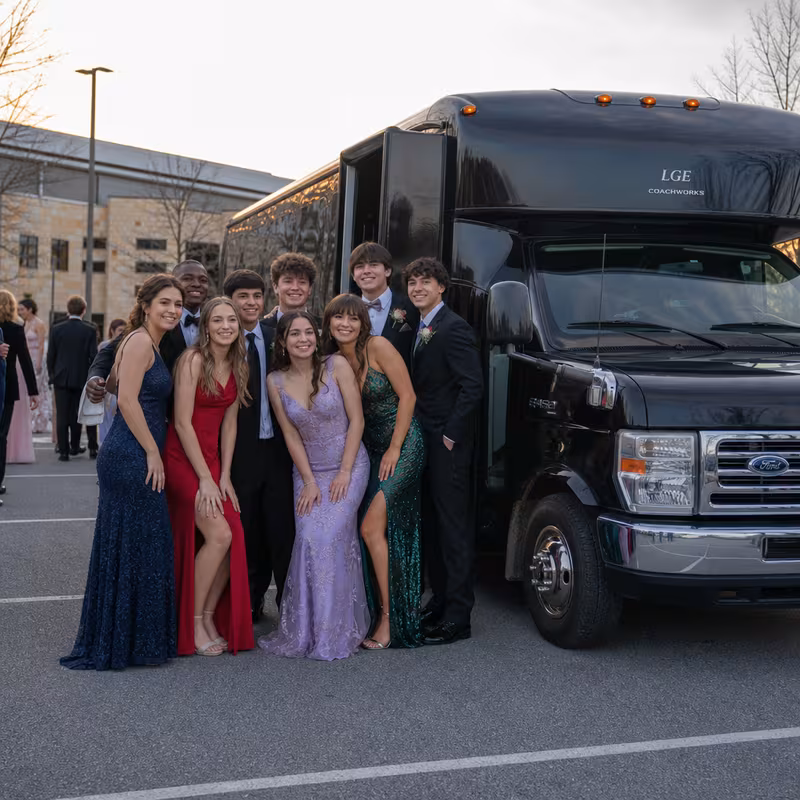 Group boarding a white charter bus for Prom & Homecoming Transportation transportation in Raleigh
