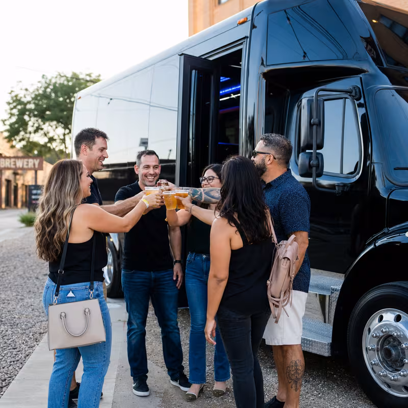 Passengers loading luggage while boarding an Raleigh group shuttle